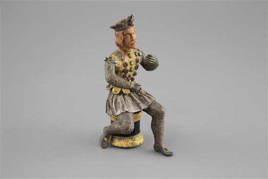 An Austro-Hungarian gilt and white metal figure of a seated knight, with jewelled decoration and hardwood head, height 11.5cm